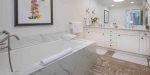 Primary bedroom ensuite bathroom with separate jacuzzi tub